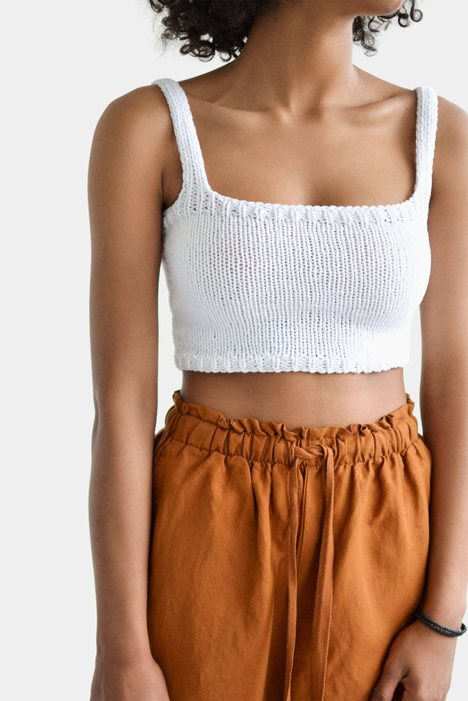 Detail of the square neck crop top in bright white
