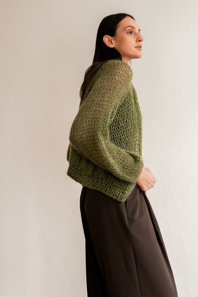 Side view of the olive green mohair hand knit bomber