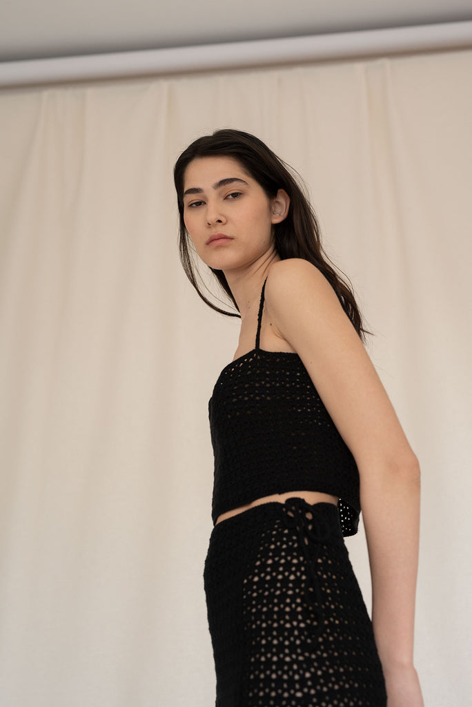 Side view of the ida crochet top in black