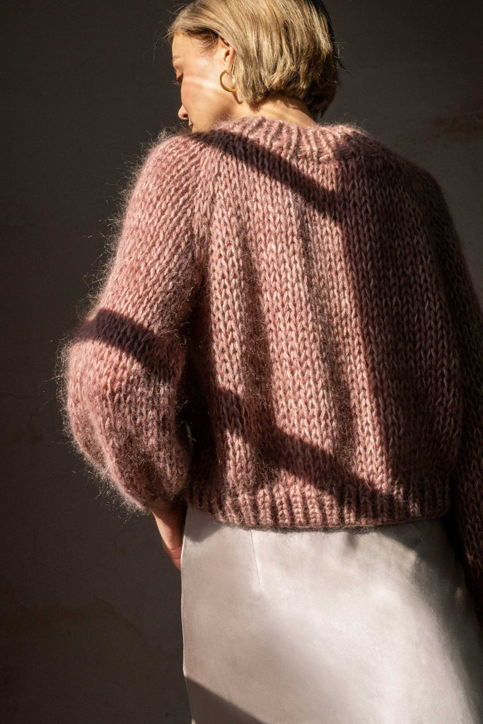 Back of the chunky braid sweater in lavender