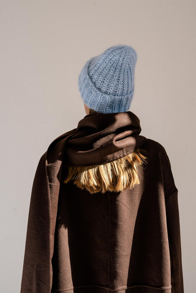 Back of the knit mohair beanie in light blue