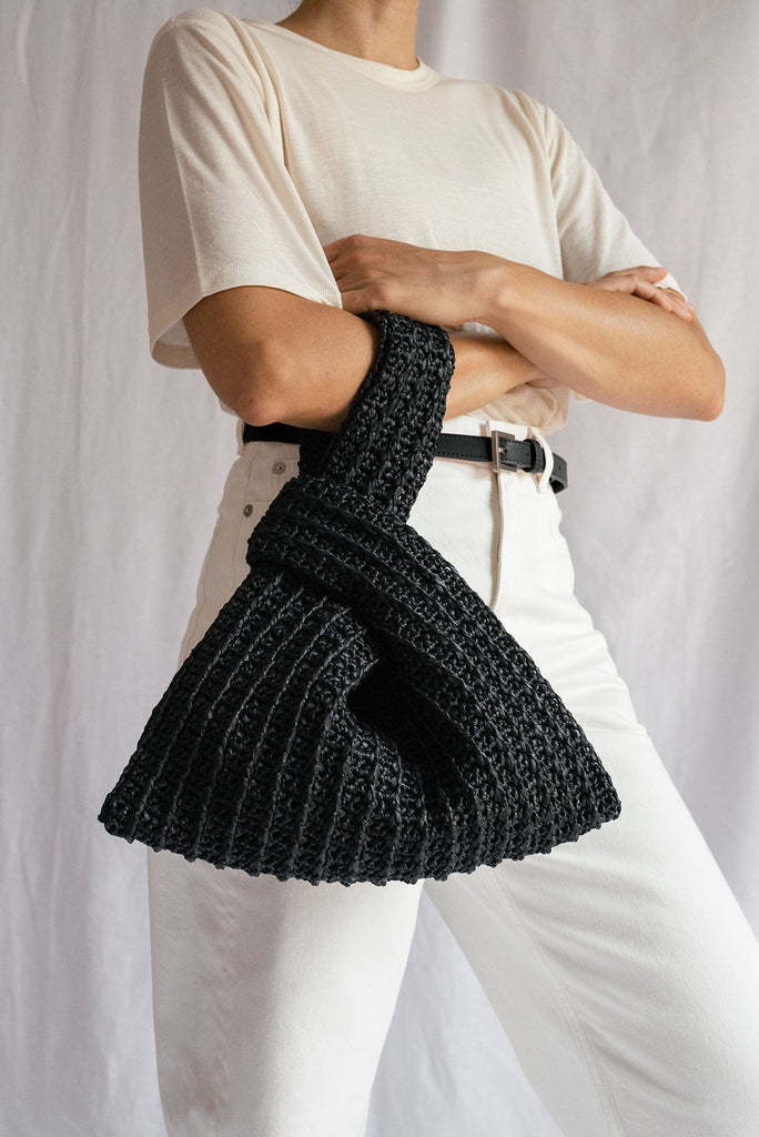 Close up of the raffia knot bag in black