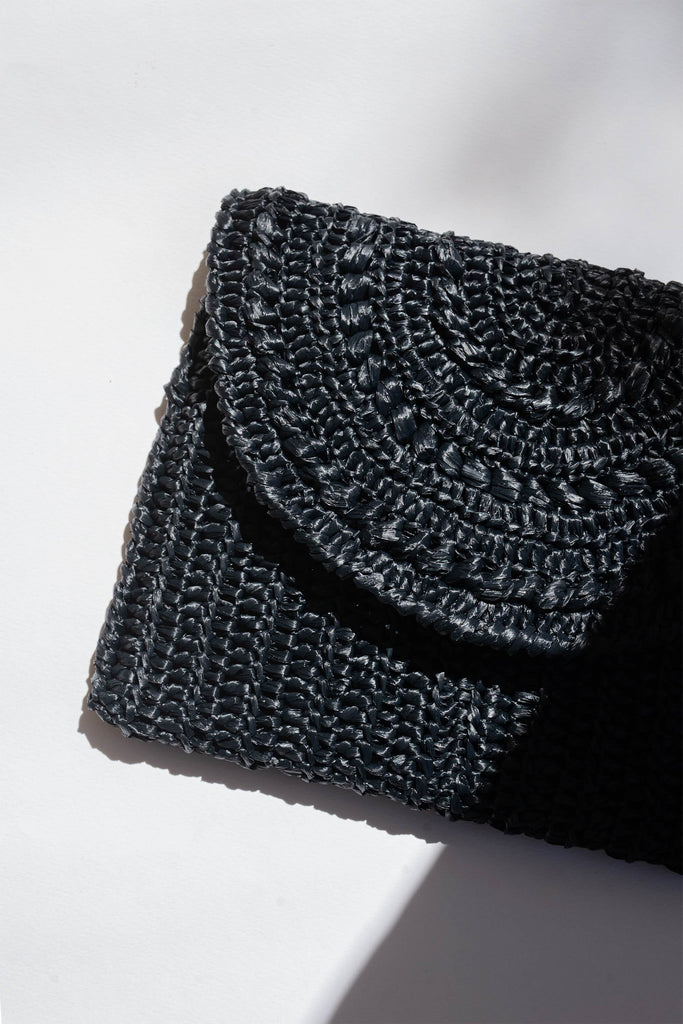 Crochet raffia clutch bag in black color