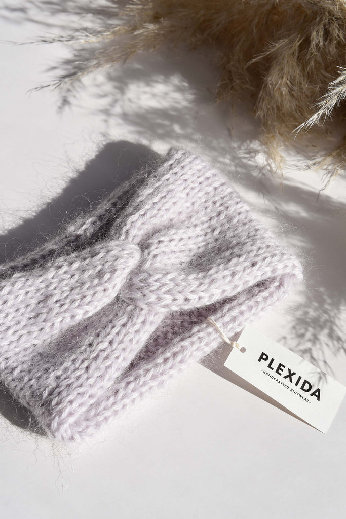 Detail of the knit mohair turban in feather lilac