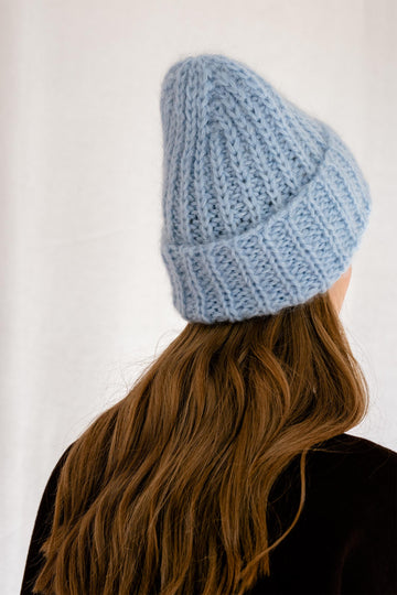 Detail of the mohair beanie hat in pastel blue