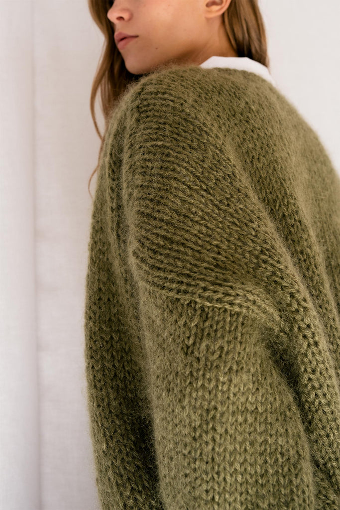 Detail of the mohair bomber cardigan in moss