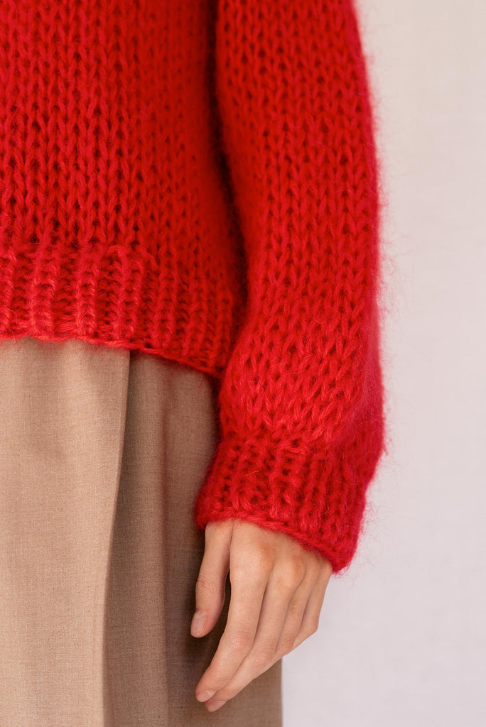 Detail of the red mohair sweater
