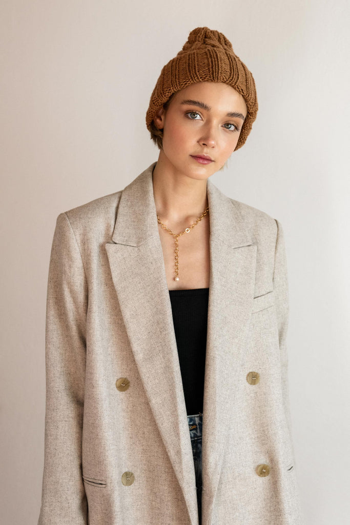 Front of the knit cable hat in caramel