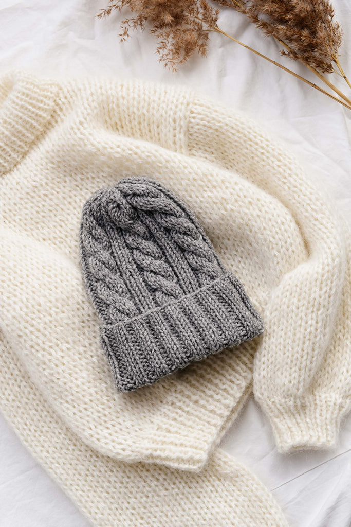 Hand knit cable hat in light grey