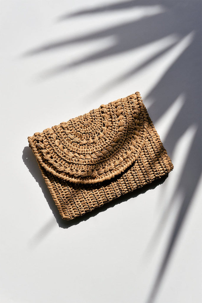 Raffia marigold clutch bag in tan color