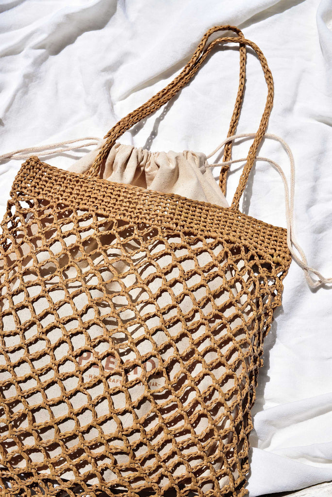 Flatlay of the raffia net bag