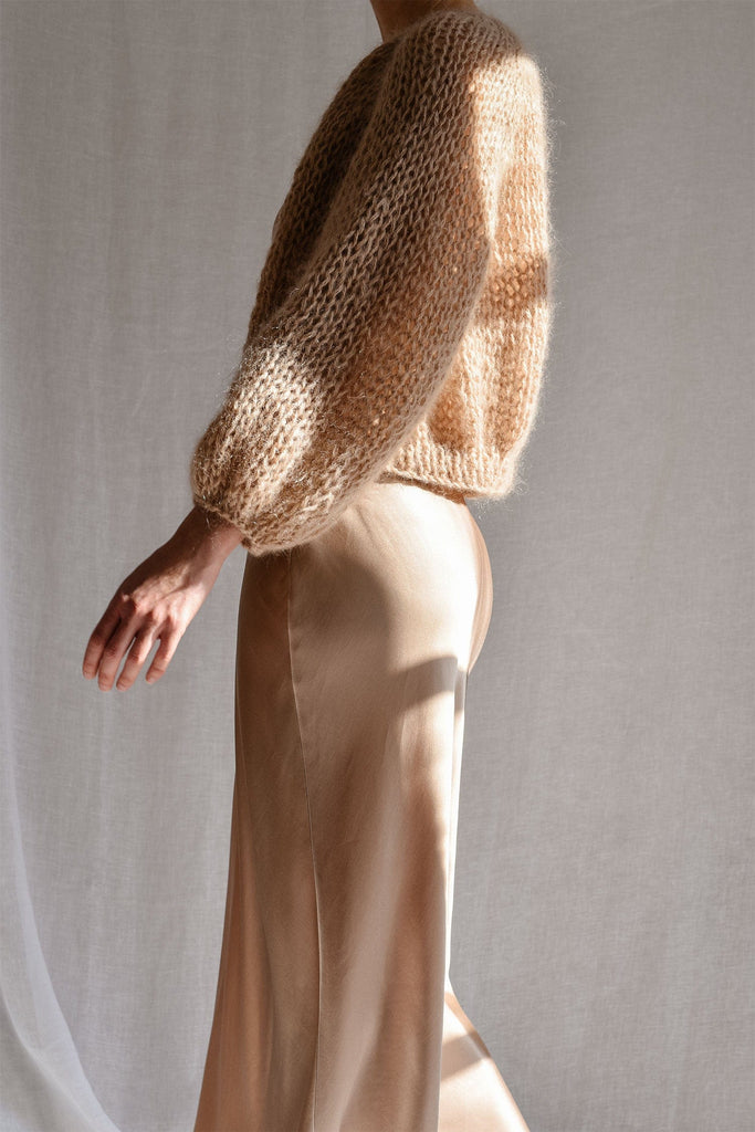 Side of the airy mohair bomber in beige color
