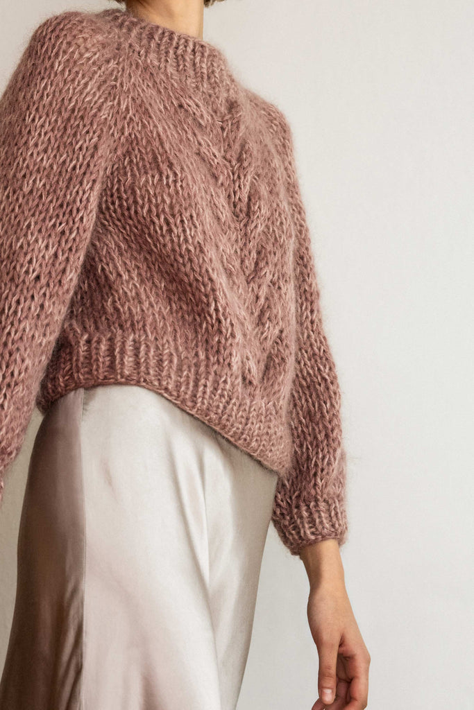 Side view of the chunky braid sweater in lavender