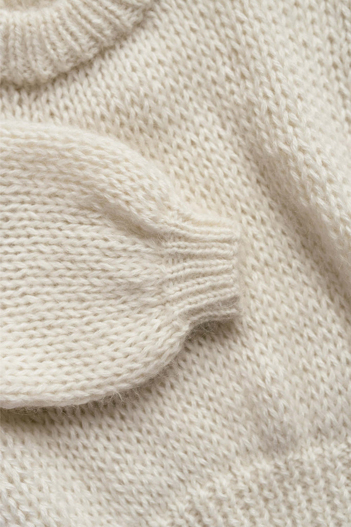 Sleeve detail of the chunky mohair sweater in cloud