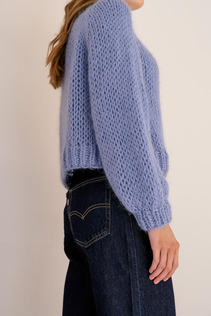 Sleeve detail of the relaxed mohair sweater in sky